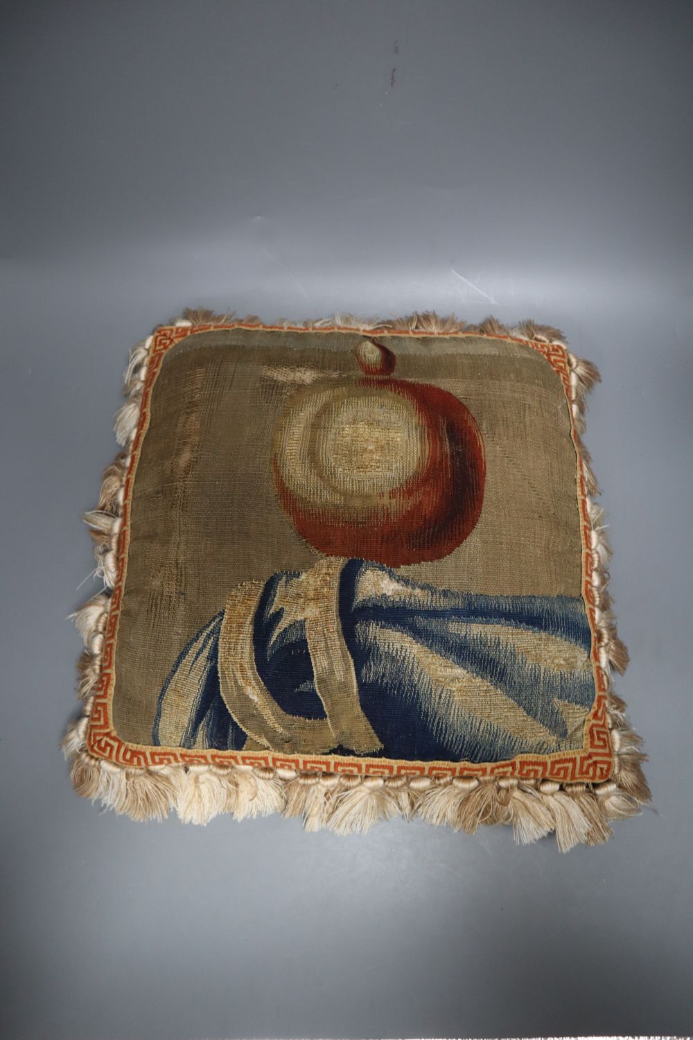 A pair of Aubusson cushions with tassel edging, 38 x 40cm